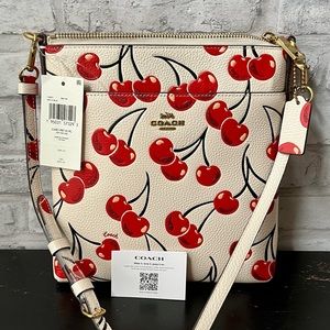 COACH Kitt Pebble Leather Messenger Crossbody With Cherry Print